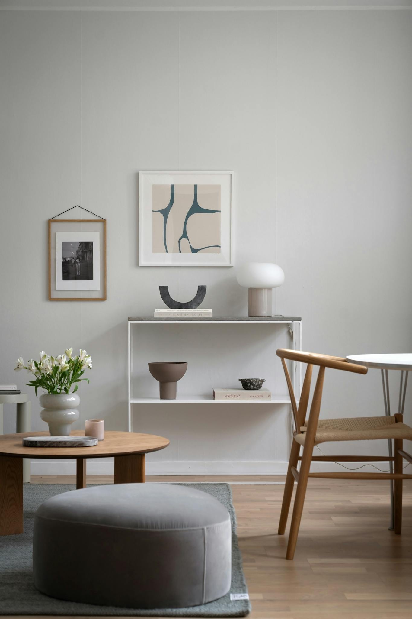 A stylish minimalist living room featuring contemporary furniture and elegant decor.